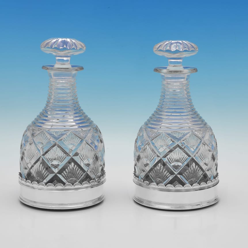 Sterling Silver Pair of Decanters & Wine Coasters - Mappin & Webb, hallmarked in 1927 Sheffield - George V